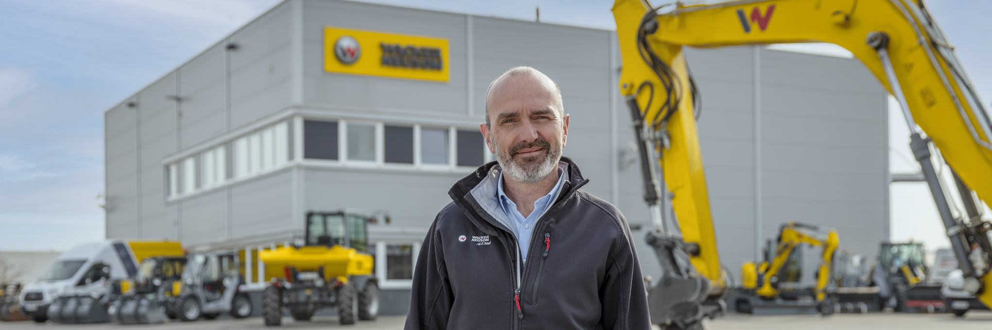 Wacker Neuson employee standing in front of Wacker Neuson rental station.