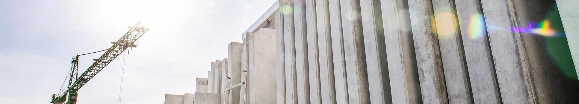 Concrete walls standing vertically on a construction site.