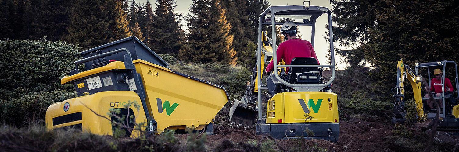 An excavator and a dumper working together